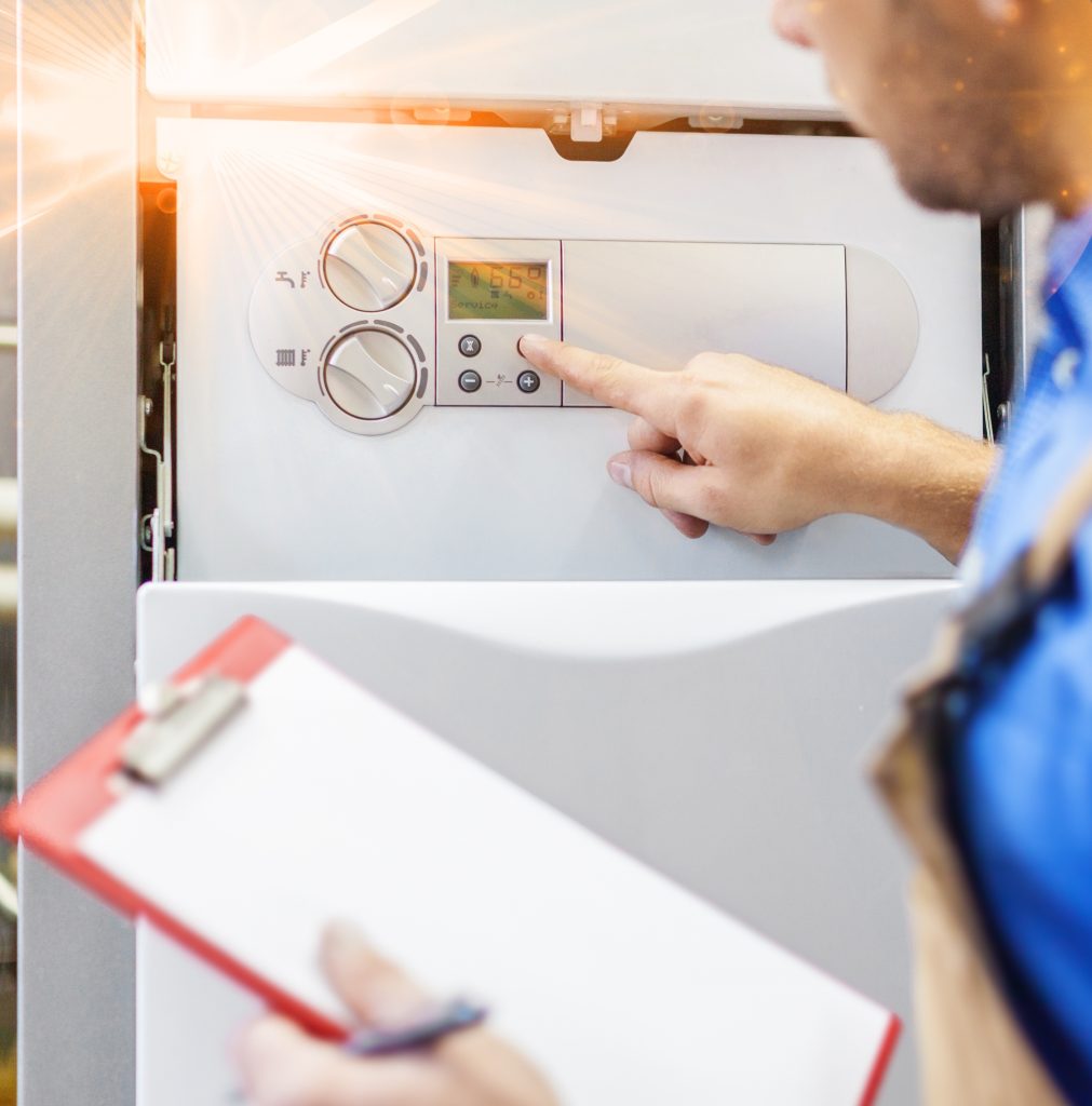 Man servicing boiler